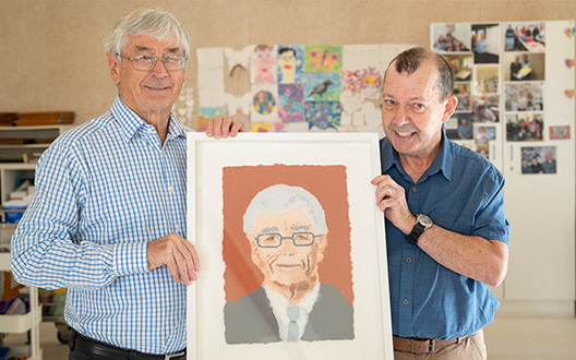 Brett and Dick Smith holding brett's artwork together