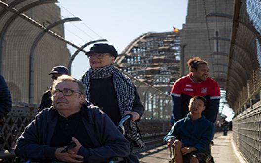 support workers and clients exploring the harbour bridge